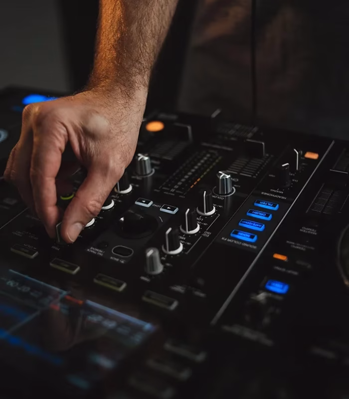 vertical-closeup-dj-working-nightclub.webp